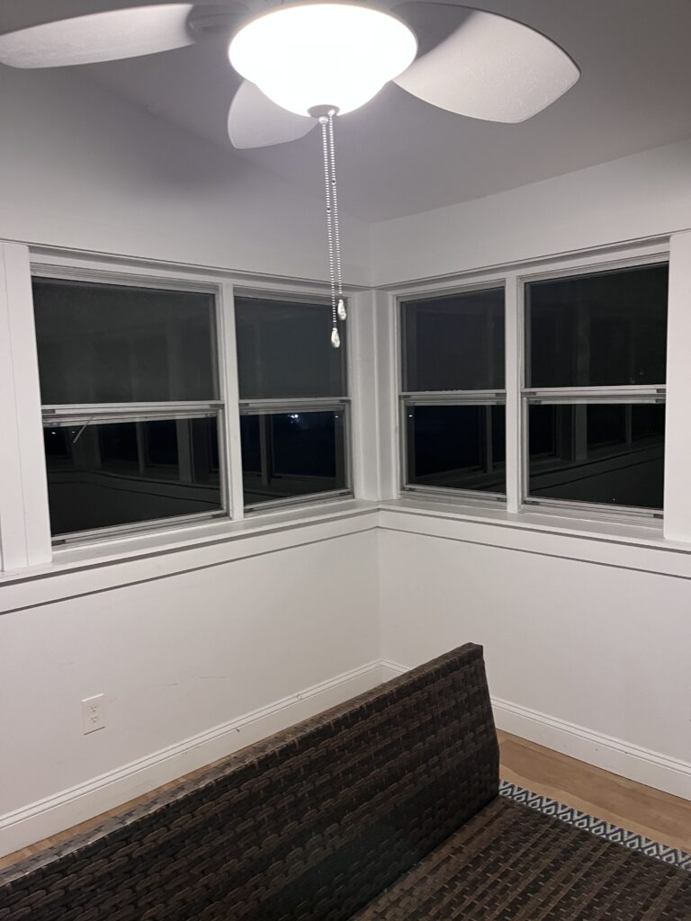 another angle of storm window before the replacement