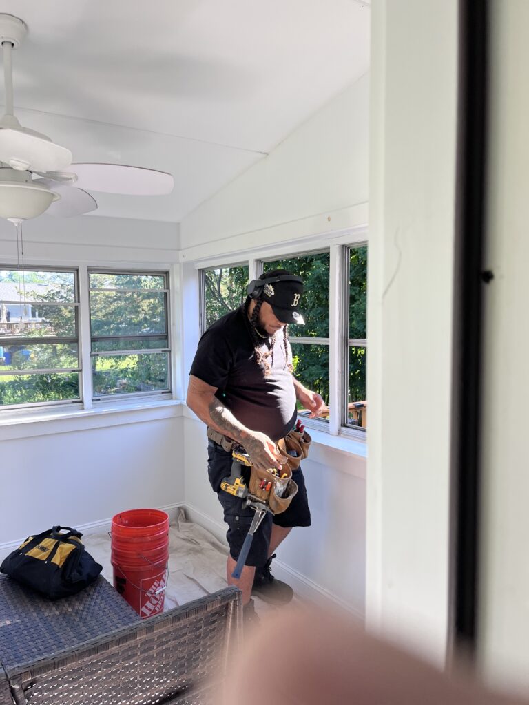crew working on installing storm windows
