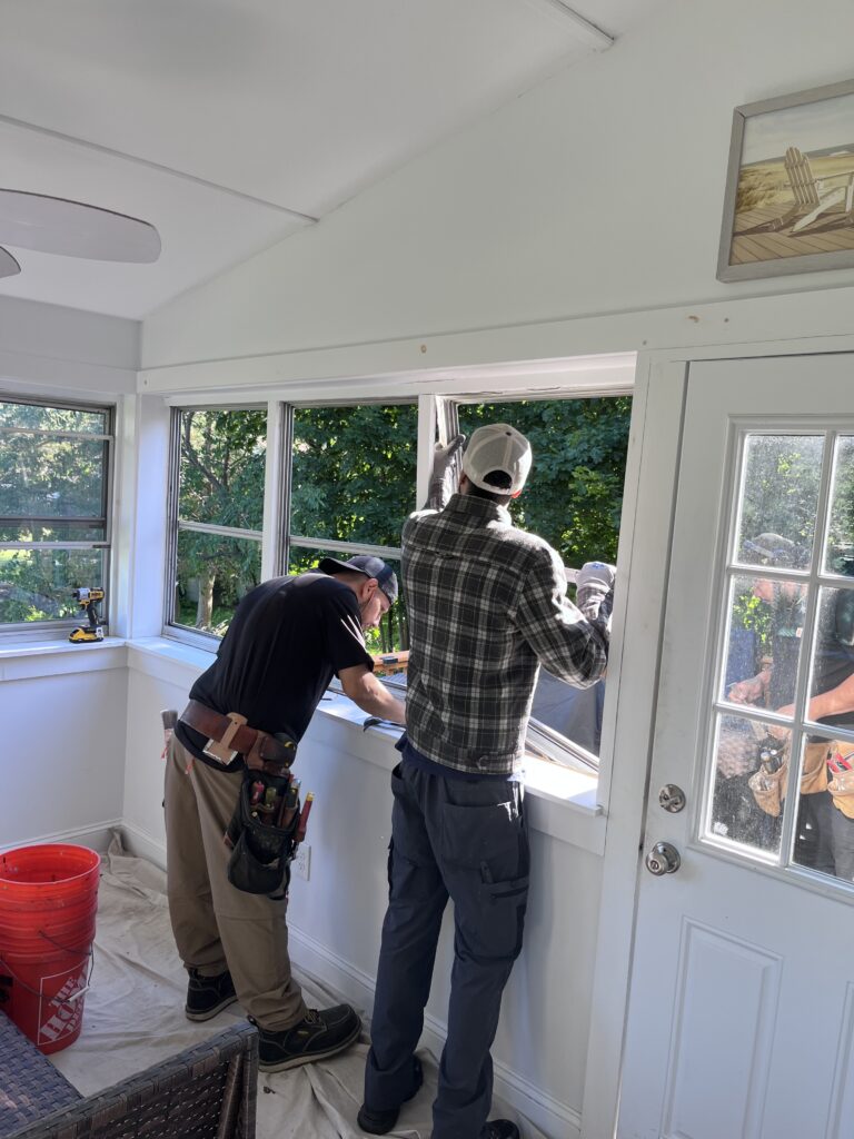 crews working on installing new porch window